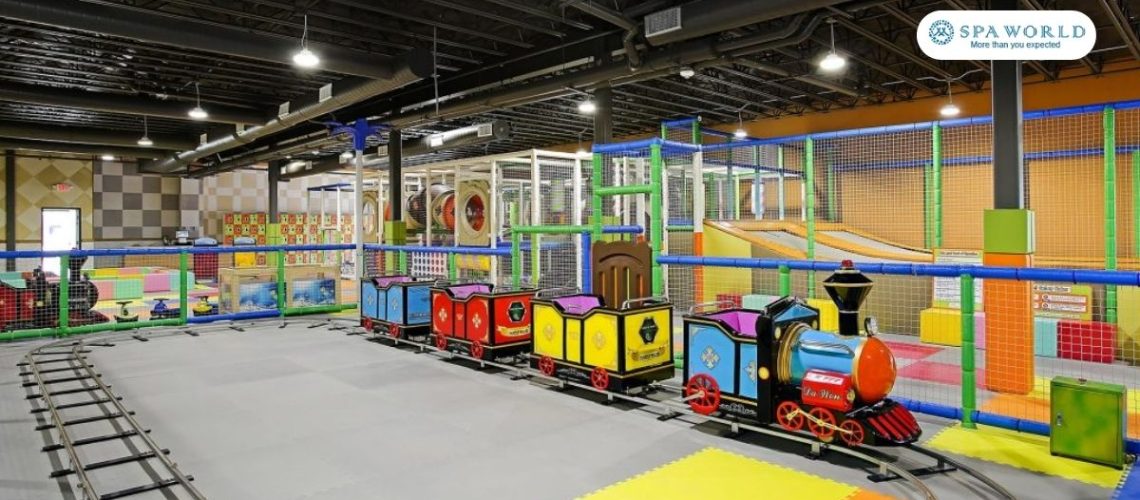 kids indoor play area in houston with train, slides, tunnel setup and more