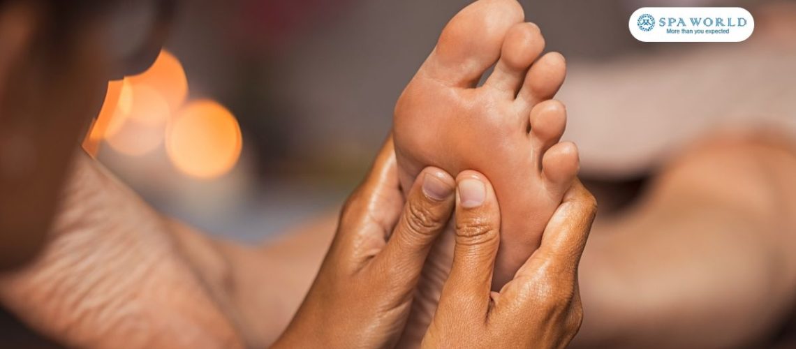 therapist performing foot reflexology